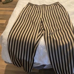 Fits loosely elastic waist side pockets.  Silky material.  Machine wash hang